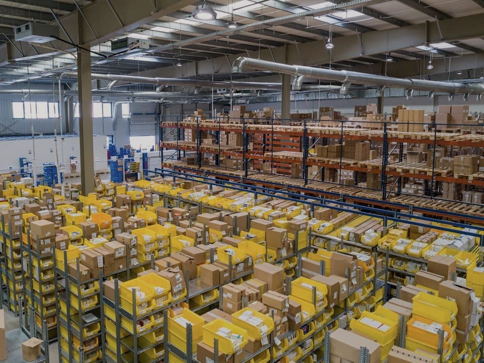A distribution warehouse floor stacked with outbound packages